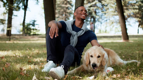 Black-man-with-dog-at-the-park
