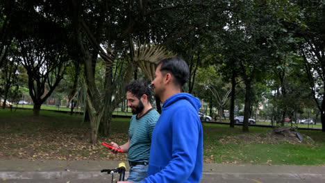 Two-men-walking-at-the-park