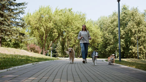 Young-woman-with-pets-at-the-park