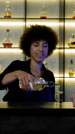 Bartender-serving-shot-to-client