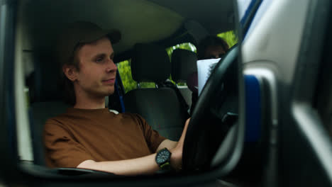 Driver-writing-inside-the-van