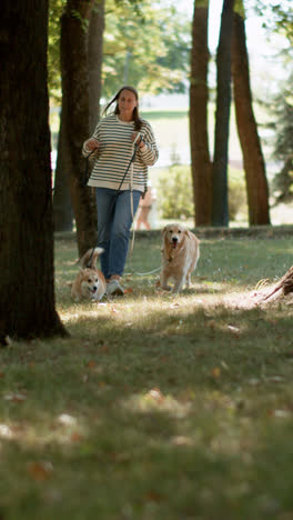 Woman-with-three-dogs