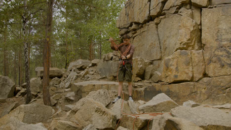 Climber-at-the-bottom-of-the-cliff