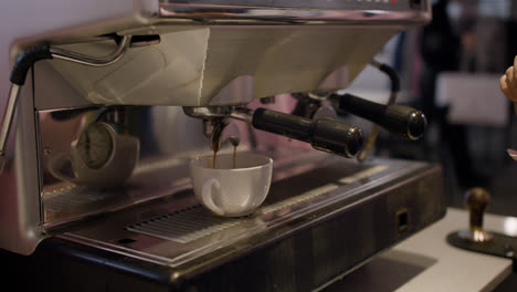 Female-barista-preparing-coffee