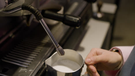 Barista-using-coffee-machine