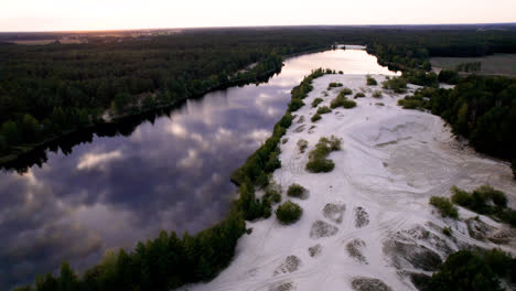Aerial-view-of-big-river-near-the-dunes-and-forest