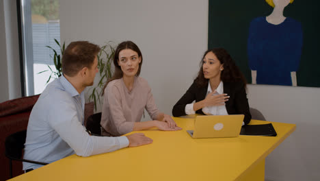 Couple-talking-on-realtor's-office