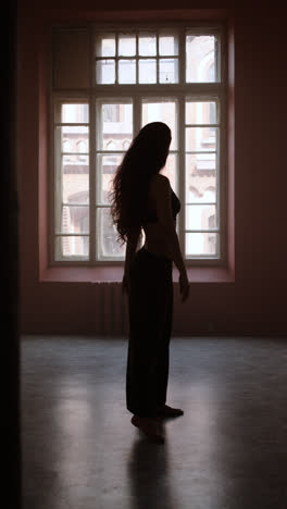 Young-woman-dancing-in-a-classroom