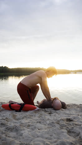 Male-lifeguard-saving-man's-life