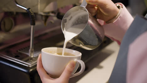 Female-barista-preparing-coffee