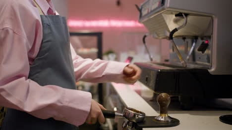 Barista-using-coffee-machine