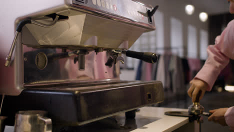 Female-barista-preparing-coffee