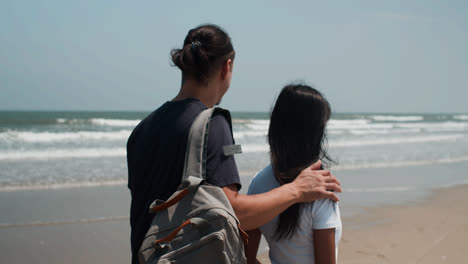 Couple-walking-on-the-beach
