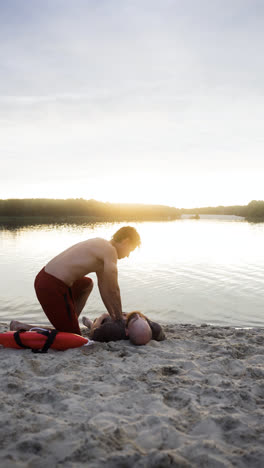 Male-lifeguard-saving-man's-life