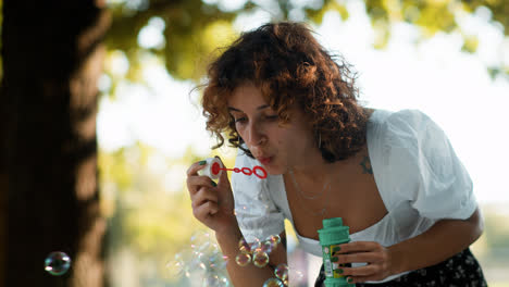Woman-blowing-bubbles-outdoors