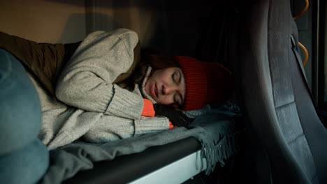 Woman-resting-inside-the-truck-cab