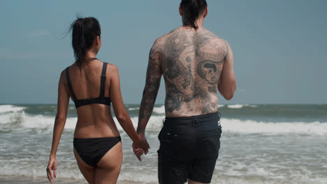 Couple-going-into-the-water