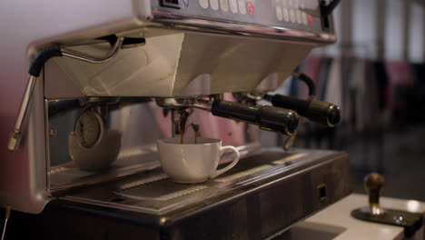 Female-barista-preparing-coffee