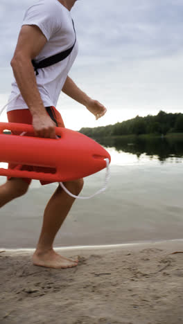 Side-view-of-male-lifeguard-at-the-beach