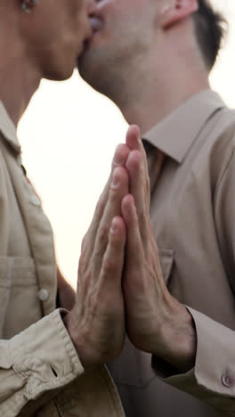 Men-holding-hands-outdoors