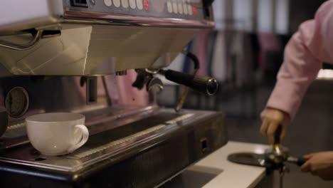 Female-barista-preparing-coffee