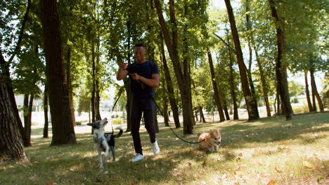 Young-man-with-pets-at-the-park