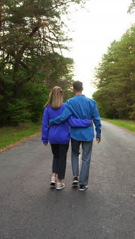 Couple-walking-in-a-road