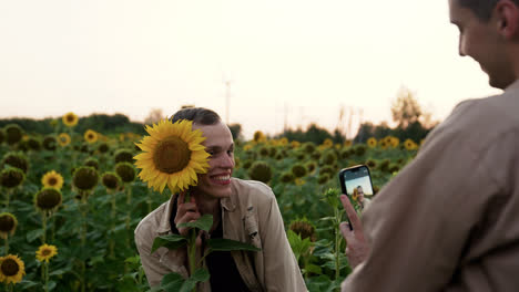 Man-posing-with-sunflower