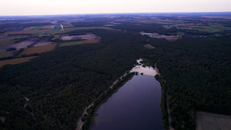 Aerial-view-of-lake-in-the-middle-of-the-forest