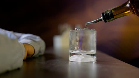 Bartender-serving-whisky