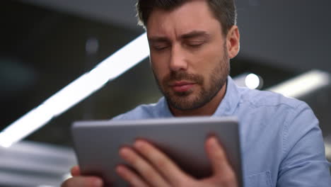 Handsome-business-man-using-a-tablet