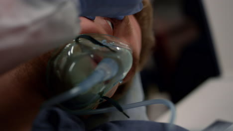 Close-up-paramedic-hand-checking-unconscious-man