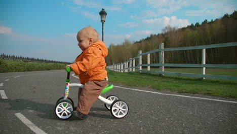 Little-kid-crossing-road-on-bike
