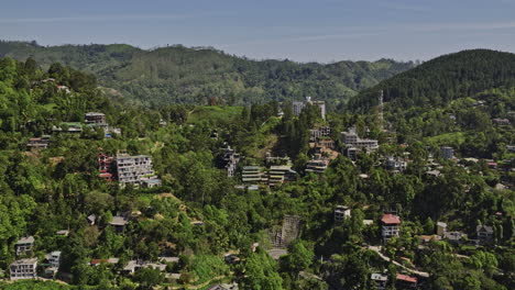 Ella-Sri-Lanka-Aerial-v24-drone-flyover-picturesque-town-in-hill-country-capturing-hillside-resort-hotels,-tranquil-retreat-surrounded-by-nature-and-mountainscape---Shot-with-Mavic-3-Cine---April-2023