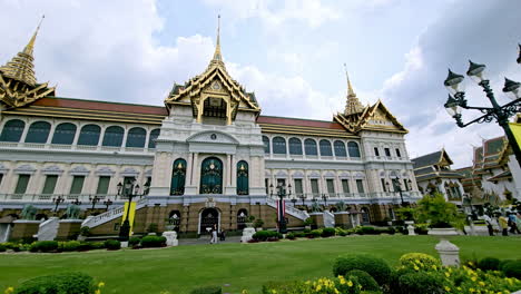 Panning-from-the-right-to-the-left-side-in-front-of-Maha-Phrasat-Throne-Hall-inside-the-Grand-Palace-of-Wat-Phra-Kaew,-a-tourist-destination-in-Bangkok,-Thailand