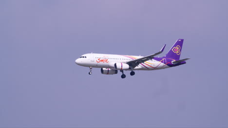 Thai-Smile-Airlines,-a-subsidiary-of-Thai-Airways-is-landing-as-it-arrives-in-Suvarnabhumi-Airport-in-Bangkok,-Thailand