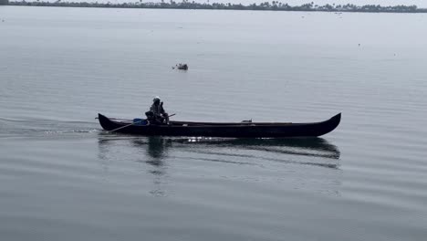 Aerial-drone-view-A-brother-is-carrying-a-bottle-in-the-middle-of-the-water-where-there-are-waves-in-the-water