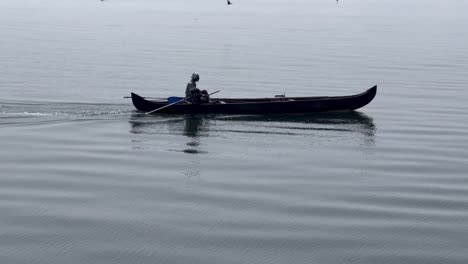 Aerial-drone-view-A-brother-is-going-to-pick-up-tourists-with-a-boat