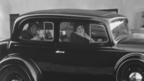 Women-Seated-Inside-a-Classic-Car-on-a-New-York-City-Street-in-the-1930s