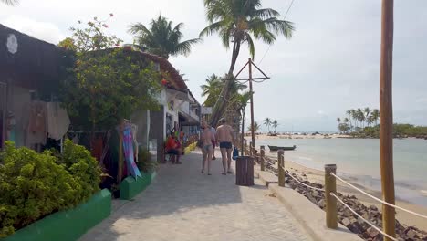 People-stroll-through-Morro-de-Sao-Paulo-in-Cairu,-Bahia,-Brazil