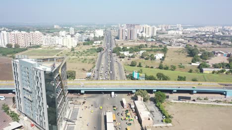 Aerial-dron-view-Drone-camera-is-pointing-downwards-where-many-vehicles-are-driving-above