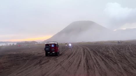 Jeep-SUV-driving-on-desert-with-exotic-mountain-view