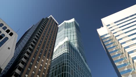 Looking-Up-At-Tokyu-Kabukicho-Tower-with-a-blue-sky