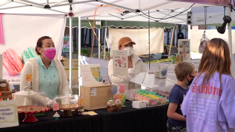 Vendors-at-the-San-Marcos-Famers-Market-during-the-COVID-19-Pandemic,-Photographed-during-the-CDC-masking-and-social-distancing-guidelines-on-4-20-21