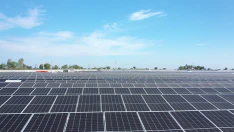 Aerial-cinematic-drone-view-Drone-camera-moving-forward-showing-lots-of-solar-panels-and-a-large-power-station