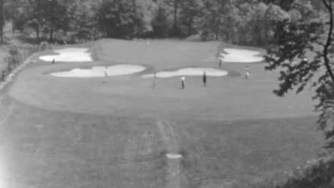 Group-of-Golfers-Enjoy-a-Sunny-Day-on-a-Lush-Green-Course-on-New-York-in-1930s