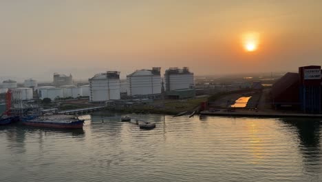 Cargo-ships-dock-at-a-designated-area-against-a-beautiful-sunset-in-the-Port-of-Phu-My,-Vietnam