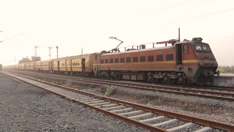 People-getting-up-on-the-train-at-a-quiet-railway-station-in-India-during-evening-time