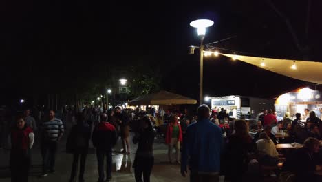 Tagore-promenade-at-night-with-full-of-people-during-the-yearly-traditional-Balatonfured-wine-weeks-at-Lake-Balaton,-Hungary