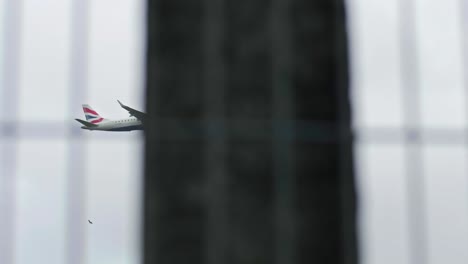 Plane-descending-over-tracks-and-a-bridge